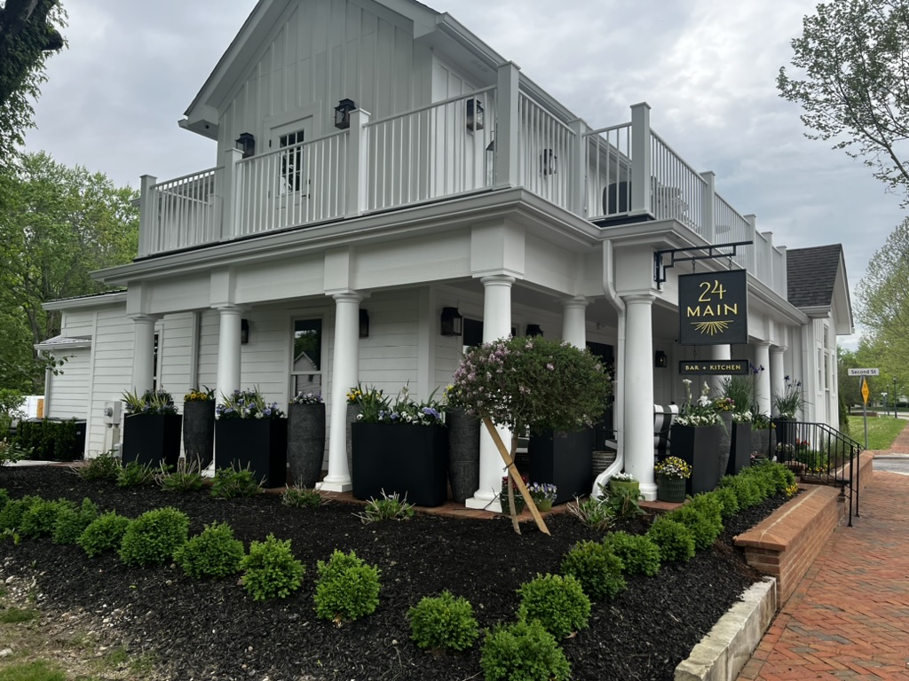 What is the difference between landscaping and hardscaping?